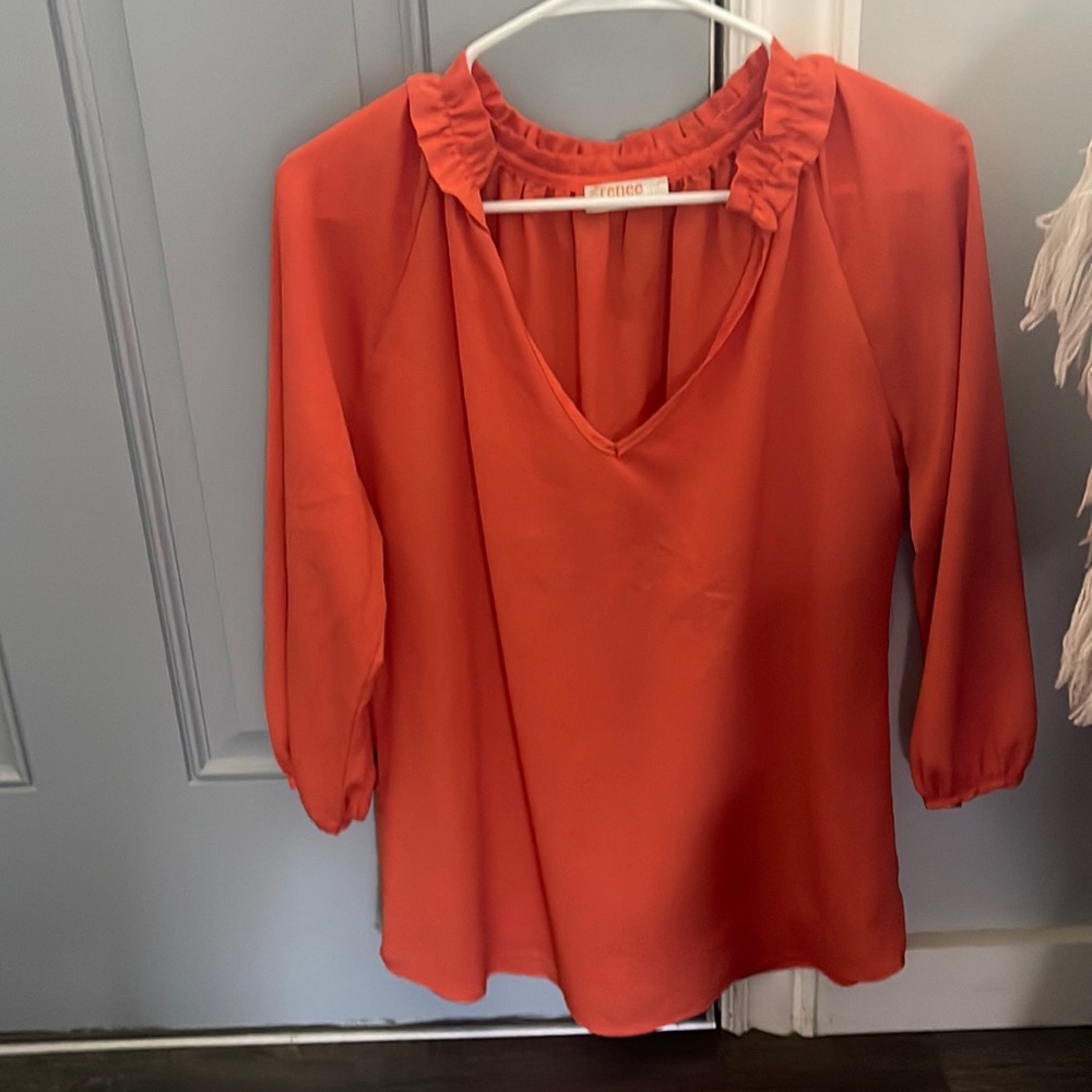 Orange renee c vneck top size medium. Long sleeve. Ruffle detail.